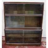 Minty Library Specialists Oxford C20th bookcase, three tiers with sliding glazed doors on plinth