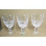 Set of twelve Waterford lead crystal stemmed port glasses with hobnail cut decoration and faceted