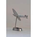Vintage wartime era cast metal Spitfire ashtray model, wingspan approx 15cm, height approx 15cm.