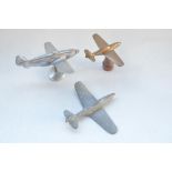 Three vintage wartime era cast metal aircraft models, no makers marks. A brass P-51 with stylised