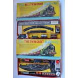 Two OO gauge 3 rail electric Trix Twin Cadet Railway sets with 2x 0-4-0 BR black tank engines, a