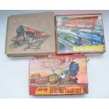 Collection of vintage O gauge train models including Mettoy clockwork Passenger Train Set No 5452