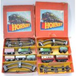Two boxed Hornby O gauge clockwork train sets (21 and 31), passenger and goods, both with 0-4-0