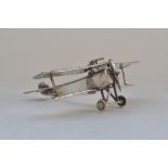 Sterling silver biplane model, most likely a Nieuport 17, stamped with 925 underside. Weight 53.