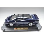 Boxed Maisto 1/12 scale blue diecast Jaguar XJ220 (1992)