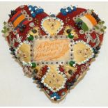 Early 20th century 'Sweetheart' heart-shaped pin cushion, decorated with beads, medal ribbons, and