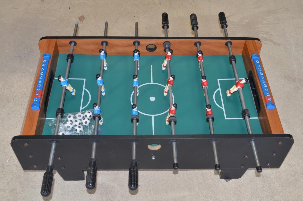Table football game with spare balls, W94 D51 H31cm