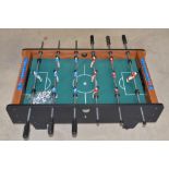 Table football game with spare balls, W94 D51 H31cm