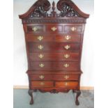 C18th style mahogany chest on stand, pierced scroll cornice and eight drawers, three drawer stand