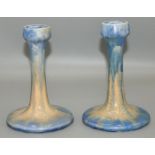 Pair of Ruskin Pottery candlesticks, streaked blue and orange glaze, impressed marks, H16.5cm (2)