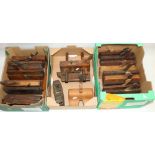 Large collection of woodworking tools, predominantly moulding planes, a sash fillister plane, and