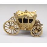 9ct yellow gold carriage charm, opening to reveal 'glass slipper', stamped 375, 9.4g