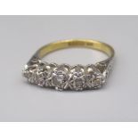 18ct yellow and white gold five stone illusion set diamond ring, stamped 18, size M, 3.1g