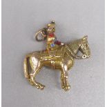 9ct yellow gold charm depicting the Queen riding a horse, stamped 375, 7.0g