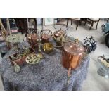Large collection of copper and brass wear including copper kettles, kettle heater, jam pan, brass