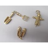 Three 9ct yellow gold charms, including scarecrow, shoes and trowel and fork, all stamped 375, 7.9g