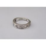 18ct white gold half eternity ring set with seven round cut diamonds, stamped 750, size O, 6.7g