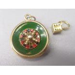 9ct yellow gold roulette wheel charm with enamel detail, stamped 375, 5.7g, and a yellow metal