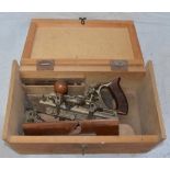 Stanley No45 plane with spare blades and 2 homemade wooden planes, with wooden storage chest