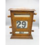 Edwardian oak desk top perpetual calendar, H22.5cm W28cm D9.8cm