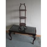 C20th mahogany three-tier folding cake stand, H88cm and a reproduction coffee table with tooled