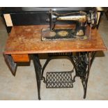 Singer treadle sewing machine on cast iron base with oak top, W100cm D40cm H100cm max