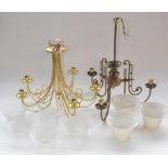 Two brass ceiling hanging light fitting with shades and a brass companion set