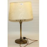 Bronzed metal table lamp, on oval base, with yellow damask type shade, and a Regency style