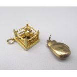 9ct yellow gold charm in the form of a boxing ring and boxers, 2.9g, and a yellow metal boxing glove