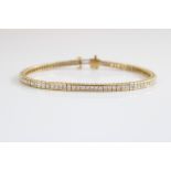 18ct yellow gold tennis bracelet set with approx.90 brilliant cut diamonds, stamped 750, L18cm (