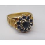 18ct yellow gold sapphire cluster ring, with decorated band, stamped 18, size J1/2, 5.2g