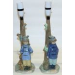 Two Nao table lamp bases modelled as children under trees, H38.5cm (2)