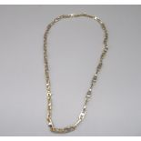 14ct yellow and white gold chain link necklace, the oval links set with central circles, stamped