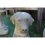 Reconstituted stone figure of a dogs head on a plaque (AF) H34cm