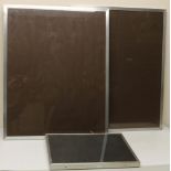 Pair of aluminium picture frames, 60cm x 75cm and another smaller, 34cm x 41cm (3)