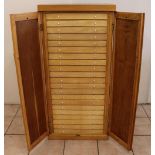 C20th light oak collectors specimen cabinet, twenty one glazed drawers containing a large collection