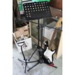 Squier Fender Strat six string black finish electric guitar, with stand, mike and music stands, (4)