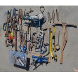 Collection of hand tools to incl. Record clamps, pick axe and spare head, pipe bender, pipe