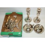 Collection of silver plate including a pair of candlesticks, H26cm, two chambersticks, cutlery,