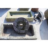 Small sandstone grindstone with square hole 38cm X 9cm