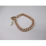 9ct yellow gold chain link bracelet with heart padlock clasp, stamped 9c, L18.5cm, 12.3g