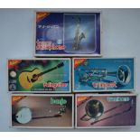 Five Music Series 1/8 scale musical instrument plastic model kits with pre-painted/chromed parts