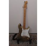 Fender Stratocaster 6 string electric guitar, serial number CA10547, Fender strap and a Fox's