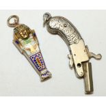 Novelty propelling pencil as an Egyptian pharaoh, enamelled decoration, L2.5cm, and a miniature