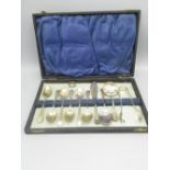 Early C20th cased EPNS cutlery set and a white metal ring