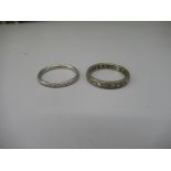 White metal eternity ring set with diamonds, no visible hallmark, size S, and a platinum band with