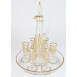 Late C19th continental glass liquor set, engraved with gilt swags and floral decoration, max H26cm