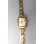 Ladies Rotary gold cased wristwatch on matching gate style bracelet, signed silvered dial, two piece