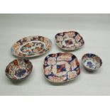 Pair of Japanese Meiji period shallow dishes W22cm, similar pattern oval plate W26cm and two rice