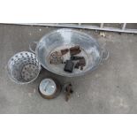 Galvanised double handled footbath/wash bin, two brass blow lamps, smoothing irons and two trivets